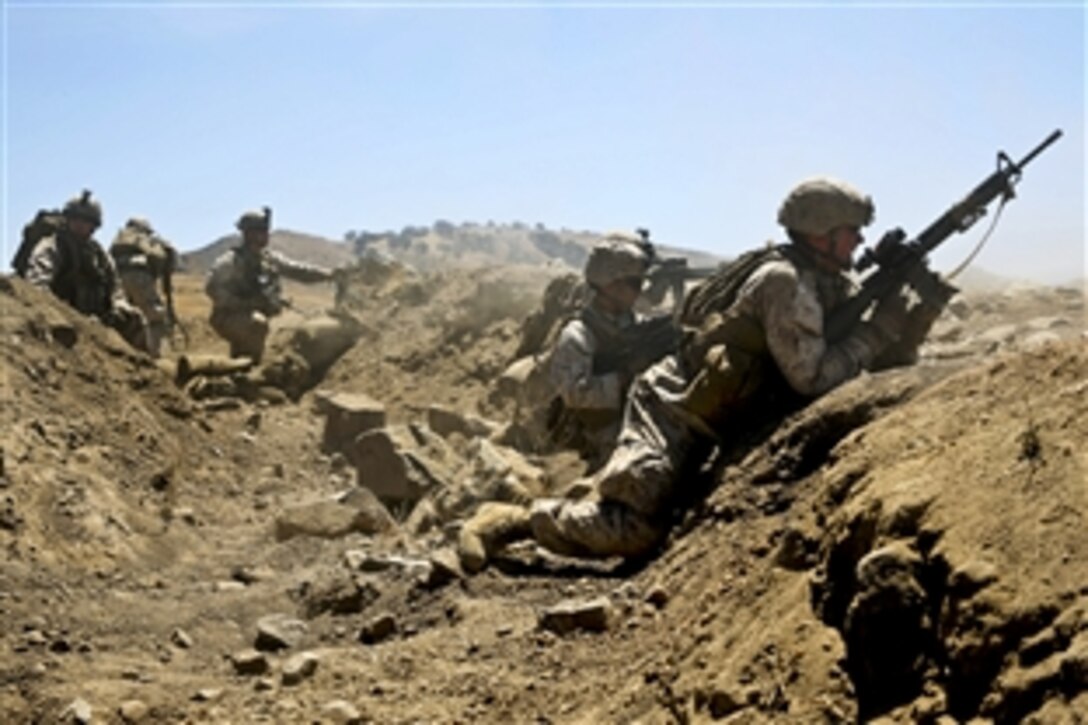 Marines engage targets from a cleared trench during live-fire training on Marine Corps Base Camp Pendleton, Calif., Aug. 12, 2013.