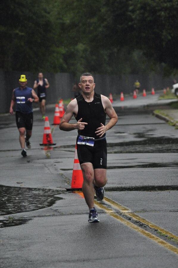 Triathlete, Jeff Odom, runs the final portion to the Quantico Triathlon on Marine Corps Base Quantico, Aug. 18, 2013. Triathletes  participated in the first Quantico Triathlon  which included a 400 meter pool swim, followed by a nine-mile bike race and finished with a five kilometer run.  