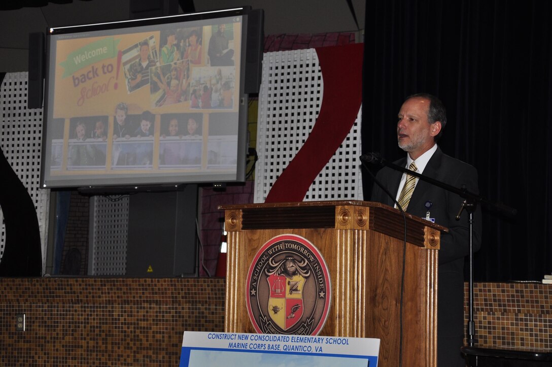 Michael Gould, Department of Defense Education Activity, New York/ Virginia/ Puerto Rico district superintendent, announced the name of the new, consolidated elementary school currently under construction on base during the teacher and staff "Back to School" training at the Quantico Middle/ High School on Aug. 14, 2013. The new school will be named Crossroads Elementary School.