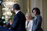 President Barack Obama looks over at First Lady Michelle Obama and Dr. Jill Biden as he delivers remarks in the East Room of the White House unveiling efforts to better coordinate and strengthen the federal government's support for military families, Jan. 24, 2011.
