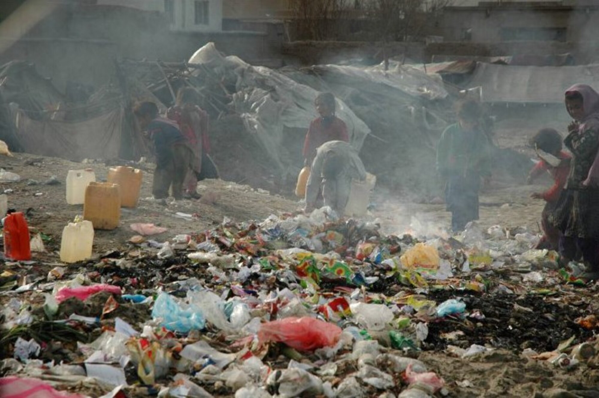 Children picking through trash piles is a daily occurrence in remote villages of Afghanistan. Inspired by their resiliency, retired Lt. Gen. John Bradley and wife Jan, founders of the Lamia Afghan Foundation, have collected and delivered more than two million pounds of aid for Afghanistan Mid-January 2010. In all, the Bradleys are working on building the seventh school and have collected and delivered more than two million pounds of supplies. (Courtesy photo)
