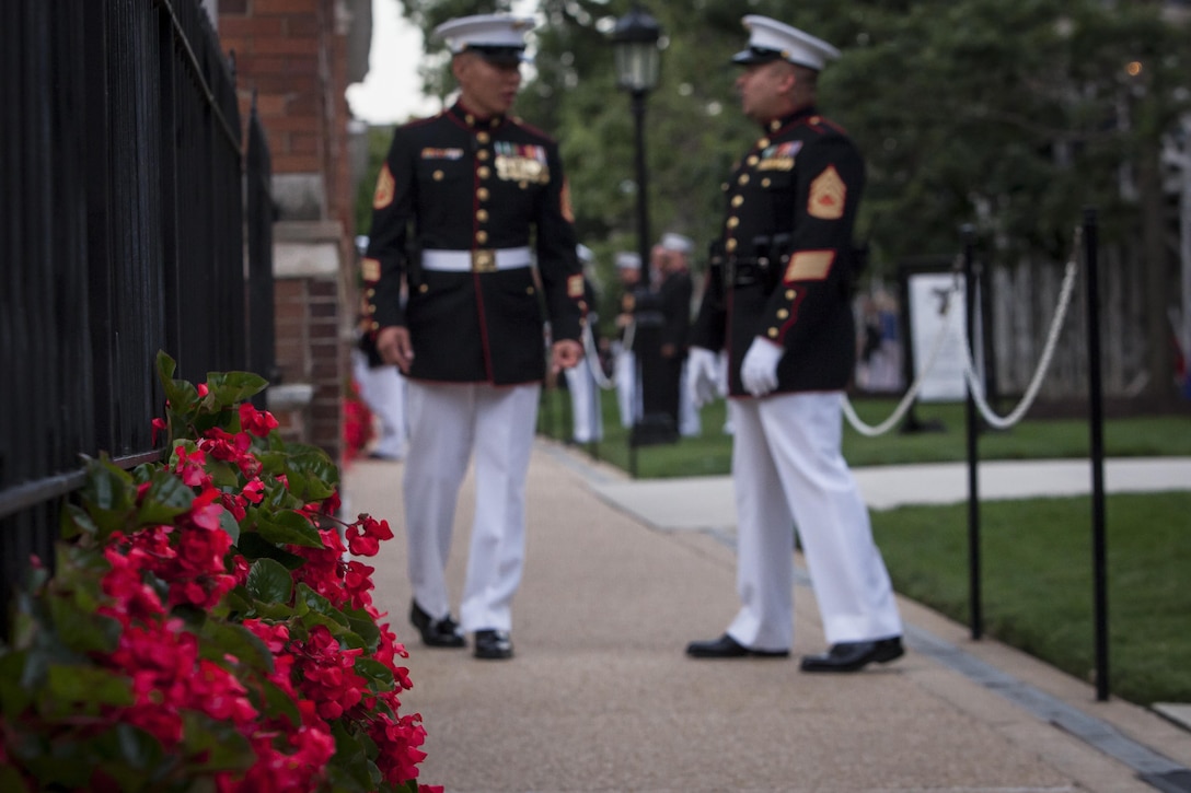 Marine with Marine Barracks Washington, D.C., populate "Officers Walk" as they wait for guests during a Friday Evening Parade at the Barracks Aug. 16. 