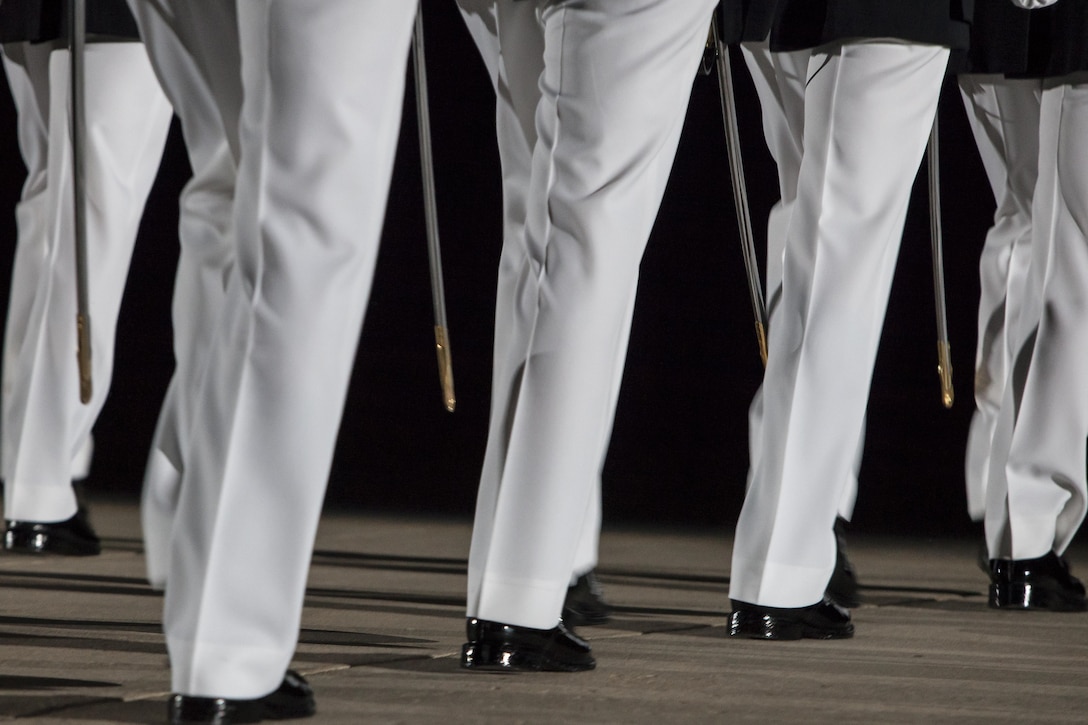 Officers with Marine Barracks Washington, D.C., march on center walk during a Friday Evening Parade at the Barracks Aug. 16. 