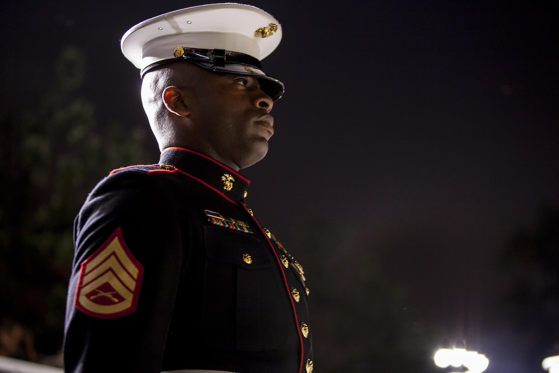Staff Sgt. Prince Covington, Jr., a parade staff member with Marien Barracks Washington, D.C., stands on his positions during a Friday Evening Parade at Marine Barracks Washington, D.C., Aug. 16. 
