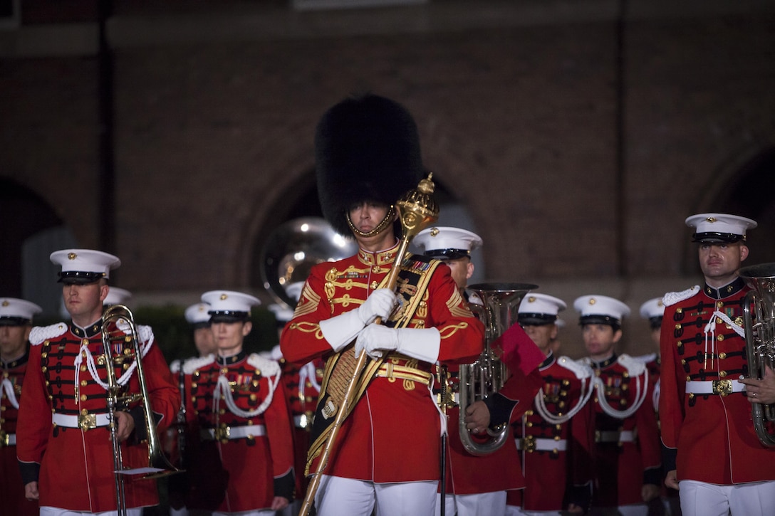 Master Gunnery Sgt. William Browne, U.S. Marine Band drum major, leads his unit during a Friday Evening Parade at Marine Barracks Washington, D.C., Aug. 16. 
