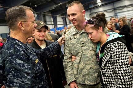 Navy Adm. Mike Mullen, chairman of the Joint Chiefs of Staff, greets U.S. Army Spc. Dennis Morgan, Jr., and Autumn Gustausen during a departure ceremony for members of the Vermont National Guard in Burlington, Vt., Jan. 8, 2010. Morgan is deploying for a yearlong tour to Afghanistan as a member of the 89th Infantry Brigade Combat Team.Navy Adm. Mike Mullen, chairman of the Joint Chiefs of Staff, greets U.S. Army Spc. Dennis Morgan, Jr., and Autumn Gustausen during a departure ceremony for members of the Vermont National Guard in Burlington, Vt., Jan. 8, 2010. Morgan is deploying for a yearlong tour to Afghanistan as a member of the 89th Infantry Brigade Combat Team.