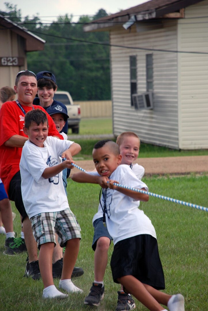 Youth at Kid's Annual Training play tug-of-war at Camp Beauregard in Pineville, La., June 16, 2010. More than 170 dependants or siblings of Louisiana National Guardsmen participated in the four-day camp intended to build leadership skills, give military children a chance to bond with other military kids and have fun.