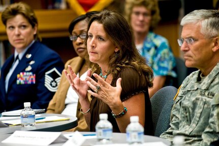 Kathryn Griffin, parent and Virginia National Guard spouse, speaks about specific Guard issues during a meeting with military members and spouses to discuss the challenges affecting military children and families at Fort Belvoir Elementary School, Va., June 22, 2010. Army Chief of Staff Gen. George W. Casey Jr., right, listens.