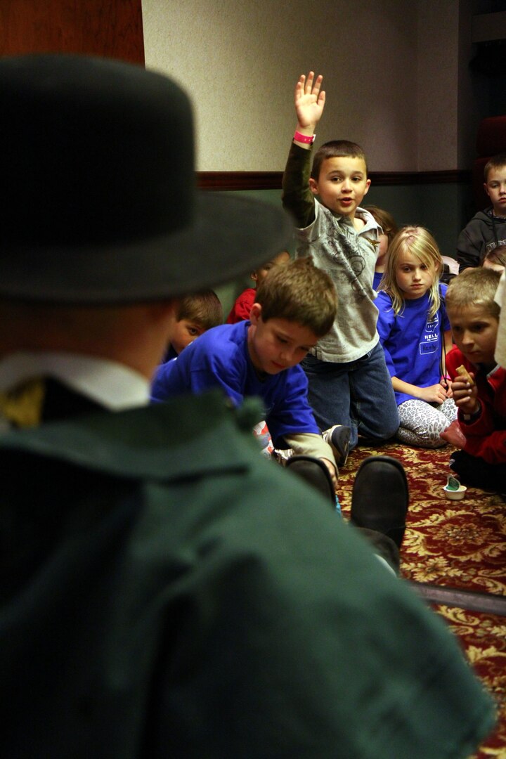 Sgt. 1st Class Joshua Mann, Ohio National Guard historian, teaches children of military members the history of the War of 1812 dressed as a Soldier from the era April 9, 2010, during the Family Readiness Conference at the Columbus Marriott Northwest Hotel in Dublin, Ohio.