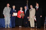 From left to right: Air Force Maj. Gen. Buddy Titshaw, special assistant to the director of the Air National Guard; Air Force Col. Penny Dieryck, the commander of the 148th Mission Support Group; Jennifer Kuhlman, the wing's Family Program manager; Minnesota Rep. Jim Oberstar; Dennis M. McCarthy, assistant secretary of defense For Reserve Affairs, and retired Vice Adm. Norb Ryan, Jr.