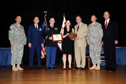 From left to right: Command Sgt. Maj. Richard Burch, Army National Guard senior enlisted advisor; Air Force Brig. Gen. Don Dunbar, the adjutant general of the Wisconsin National Guard; Army Col. Steven Bensend, 32nd Infantry Brigade Combat Team commander; Jannell Kellett, 32nd IBCT Family Readiness Group leader; Dennis McCarthy, assistant secretary of defense for reserve affairs; Army Brig. Gen. Timothy Kadavy, Army National Guard deputy director; and retired Vice Adm. Norbert Ryan, Jr., president of the Military Officers Association of America, at the presentation of the 2009 Department of Defense Reserve Family Readiness Award for the Army National Guard. Kellett and her team of more than 100 volunteers supported the morale and readiness of the 32nd Brigade's Soldiers and their families during a 12-month deployment to Iraq.