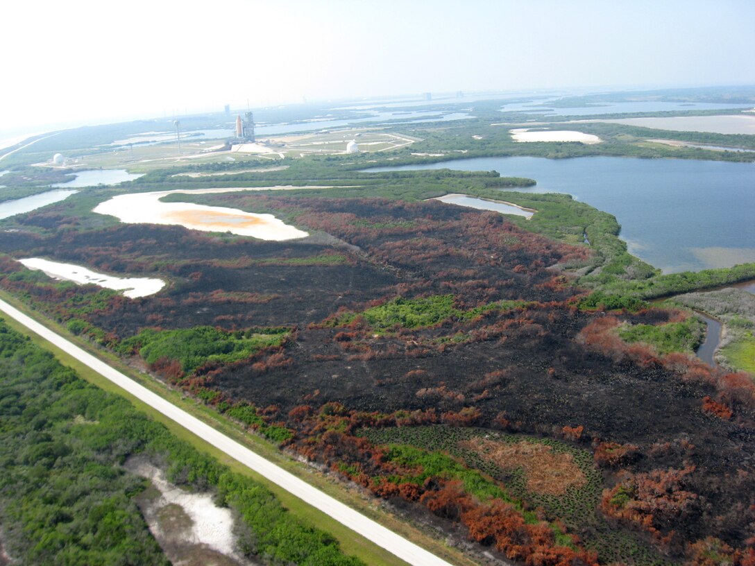A pad fire between two NASA space shuttle launch pads at Kennedy Space Center in May 2011 was sparked by a lightning strike in the Merritt Island National Wildlife Refuge. Prescribed burns occur regularly at the MINWR to reduce hazardous fuel loads, reduce encroachment of woody vegetation and to replenish nutrients to the soil.  Potential UAS flights would assist with not only wildlife and environmental data collection, but also prescribed burn support. 