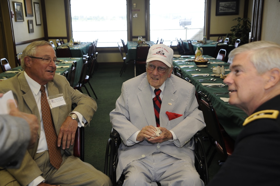 Mr. George C. Grugett (center) talks with Corps of Engineers retiree Dusty Rhodes (left) and former Mississippi River Commission President Maj. Gen. Michael Walsh just before the ceremony begins.