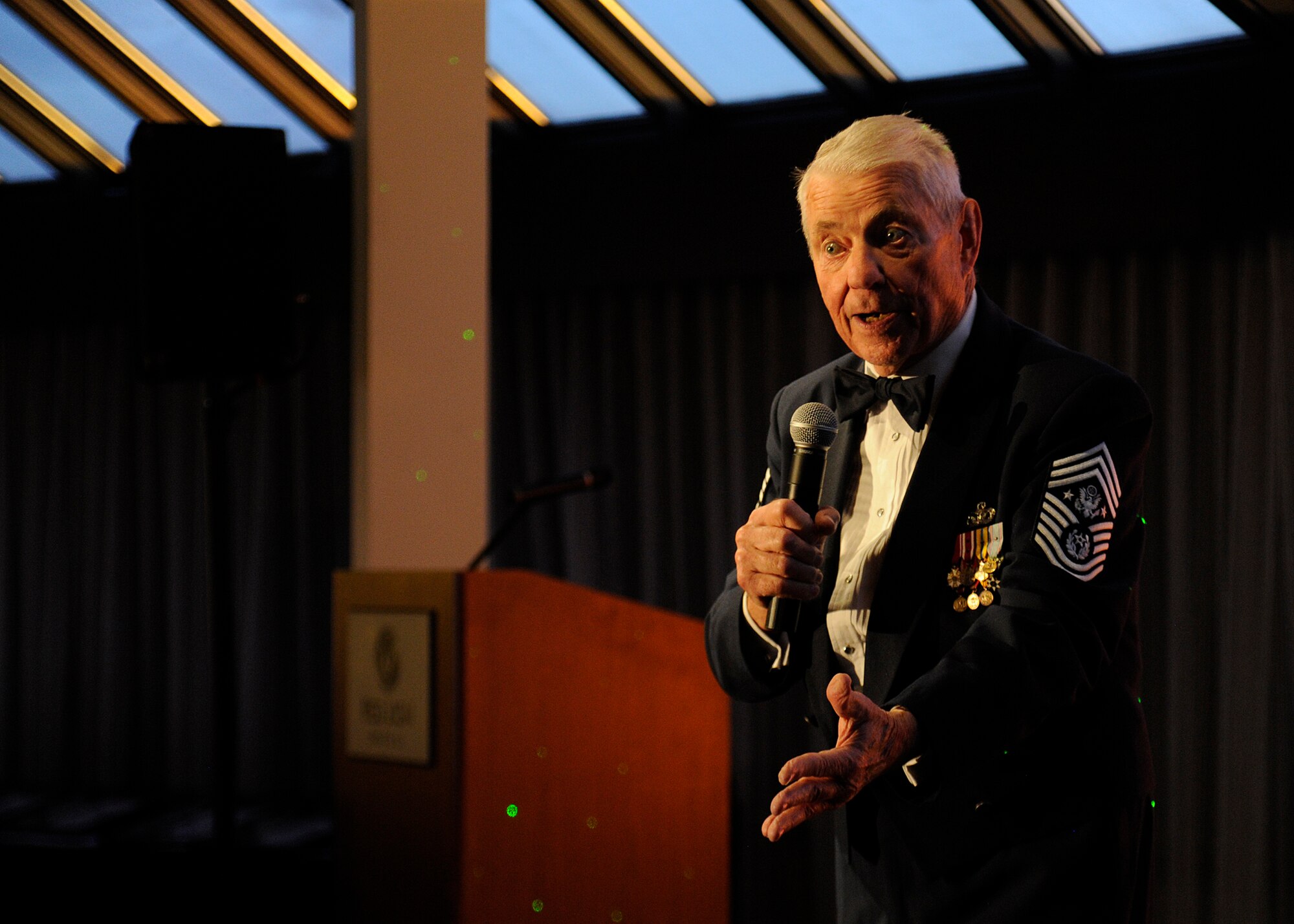 Retired Chief Master Sgt. Robert Gaylor, Fifth Chief Master Sergeant of the Air Force, speaks to members of Team Fairchild during the Senior NCO Induction ceremony in Spokane, Wash., Aug. 16, 2013. Gaylor spoke about his time in the Air Force and emphasized the importance of the senior NCO’s. (U.S. Air Force photo by Airman 1st Class Ryan Zeski/Released)