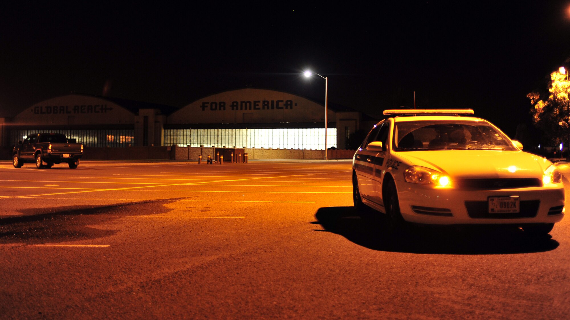 Senior Airman Christopher Rodriguez, 92nd Security Forces Squadron installation patrolman, arrives on scene during an unannounced alarm at Fairchild Air Force Base, Wash., Aug. 8, 2013. The 92nd SFS provides security for 35 KC-135 Stratotankers, in-transit aircraft and a mass conventional weapons system storage area. (U.S. Air Force photo by Senior Airman Taylor Curry/Released)