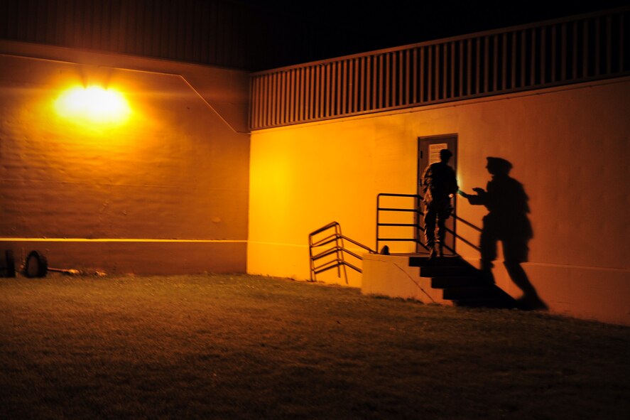Senior Airman Christopher Rodriguez, 92nd Security Forces Squadron installation patrolman, completes a sweep of a building during an unannounced alarm at Fairchild Air Force Base, Wash., Aug. 8, 2013. The mission for the 92nd SFS is to provide worldwide expeditionary combat support and force protection for the 92nd Air Refueling Wing, 141st Air Refueling Wing, Air Force Survival School and 15 joint tenant units. (U.S. Air Force photo by Senior Airman Taylor Curry/Released) 