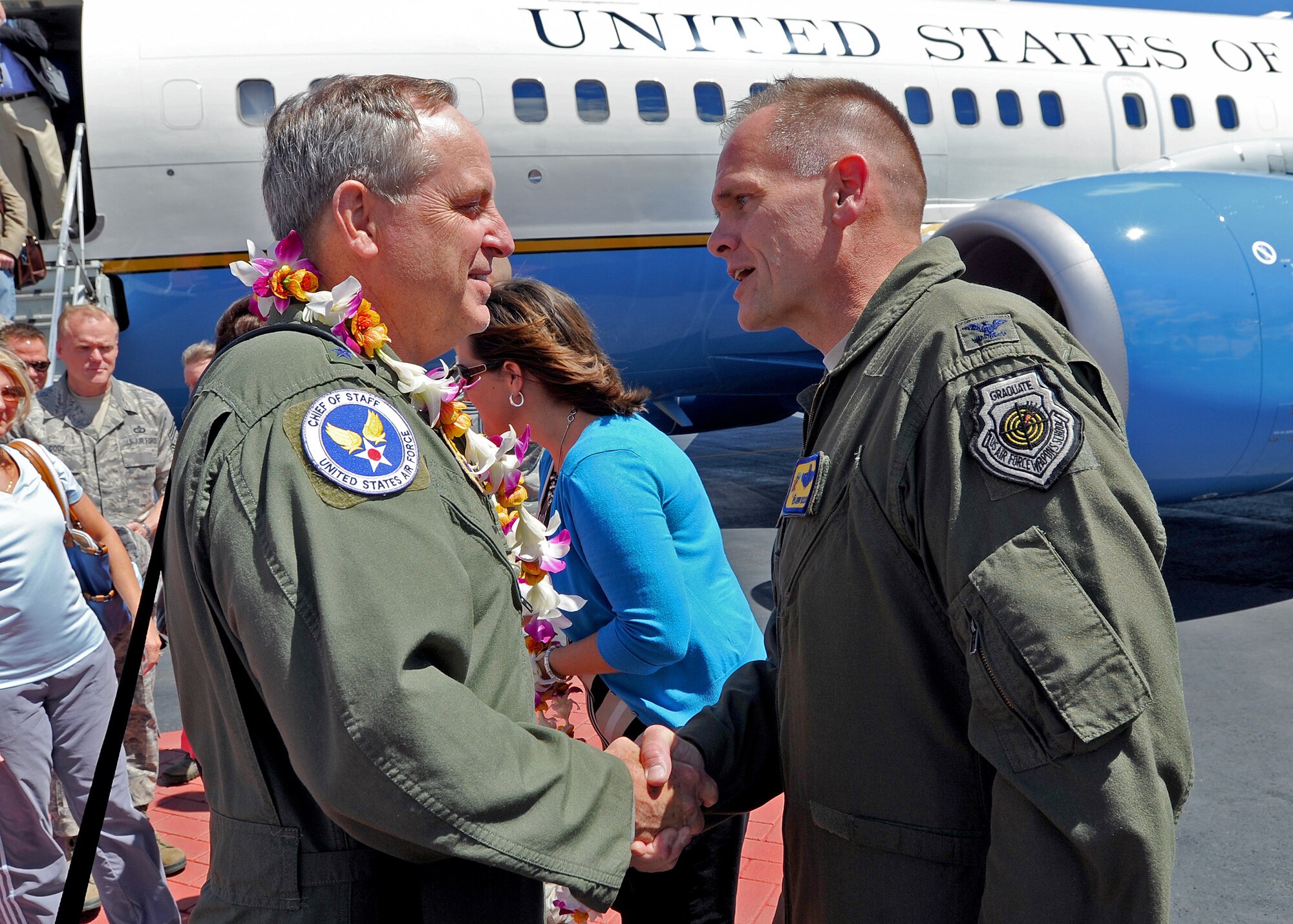 Col. John Roscoe, 15th Wing commander, right, welcomes Air Force Chief of Staff Gen. Mark A. Welsh III, left, on his arrival at Joint Base Pearl Harbor-Hickam, Hawaii, Aug. 18, 2013.  This is Welsh's first visit to the region as Air Force chief of staff, and JBPH-H is the first leg on a trip to Air Force bases throughout the Pacific region.  While at JBPH-H, Welsh and Chief Master Sergeant of the Air Force James Cody met with Airmen from the 15th Wing and Headquarters Pacific Air Forces. (U.S. Air Force photo/Tech. Sgt. Jerome S. Tayborn)