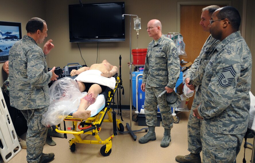 Maj. Christopher Shamblin, 2nd Medical Group education and training flight commander, briefs Chief Master Sgt. Terry West, 8th Air Force command chief, about medical training during his visit to the 2nd Medical Group on Barksdale Air Force Base, La., Aug. 20, 2013. The dummies used for training can be operated by remote control in another room, making scenarios more like those in the real world. (U.S. Air Force photo/Senior Airman Sean Martin)