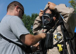 Soldiers with the 53rd Civil Support Team, Indiana National Guard, Joint Force Headquarters Ind., check their radio equipment before a route reconnaissance mission, Aug. 12, 2013, during the Vibrant Response 13-2 exercise at the Muscatatuck Urban Training Center, Ind. (U.S. Army photo by Staff Sgt. Tomora Clark/Released)
