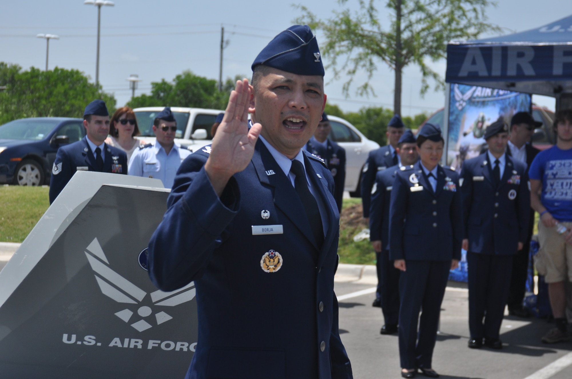 Col. Robert Borja, 369th Recruiting Group commander, administers the oath of enlistment to more than 60 Delayed Entry Program members at the opening ceremony of the 341st Recruiting Squadron hub in Austin, Texas, Aug. 1.  (U.S. Air Force photo/Staff Sgt. Hillary Stonemetz)