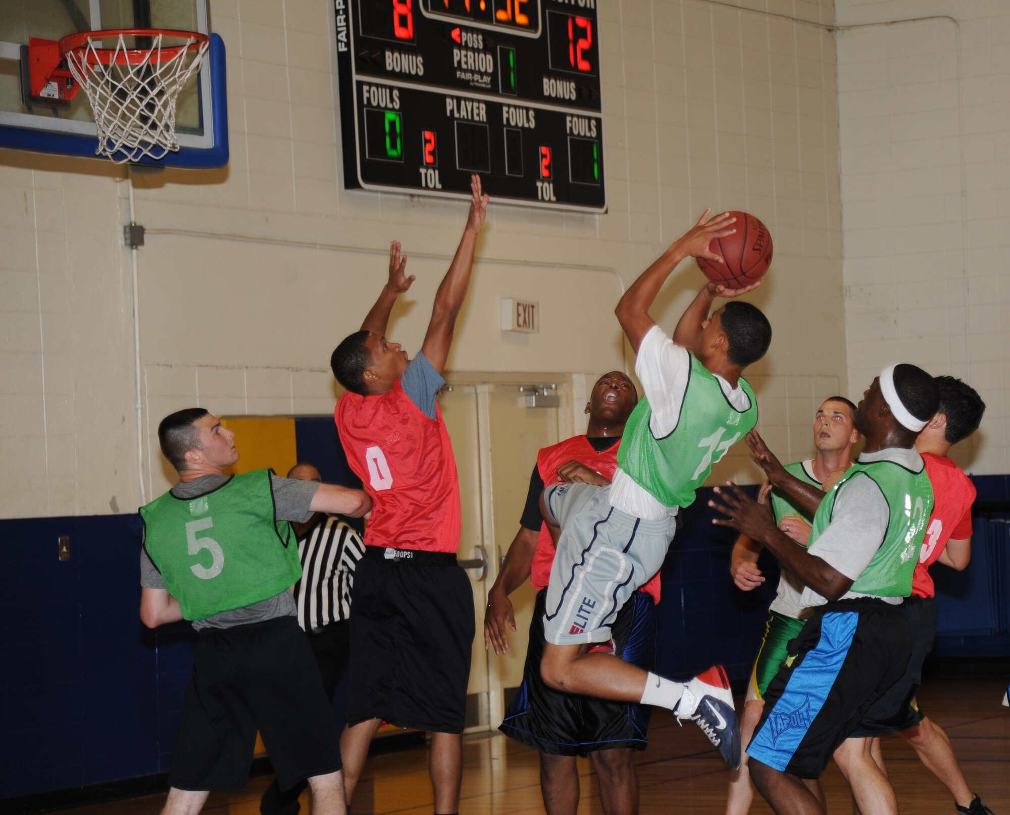 Cameron King, 336th Training Squadron, leaps for a jump shot during an intramural basketball game Aug. 19, 2013, at the Blake Fitness Center, Keesler Air Force Base, Miss. The 81st CS defeated the 336th TRS, 60-50.  (U.S. Air Force photo by Kemberly Groue)