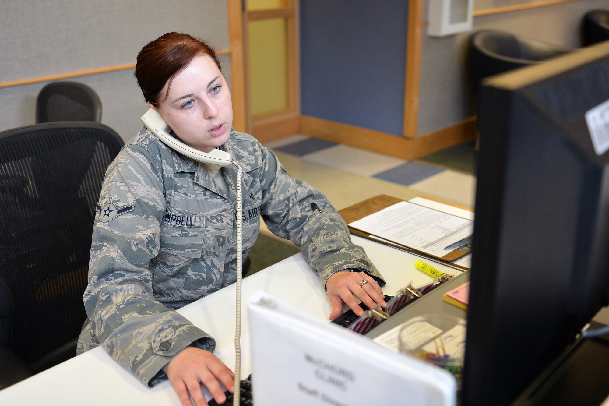 Airman Taylor Campbell, 62nd medical Squadron aerospace medical technician helps a patient over the phone at the 62nd MDS Airmen’s Clinic Aug. 12, 2013 at Joint Base Lewis-McChord, Wash. Utilizing the clinic’s Relay Health secure messaging program, Airmen can request to renew or refill prescriptions, schedule appointments, extend profiles, and get medical advice from their doctor. (U.S. Air Force photo/Airman 1st Class Jacob Jimenez)