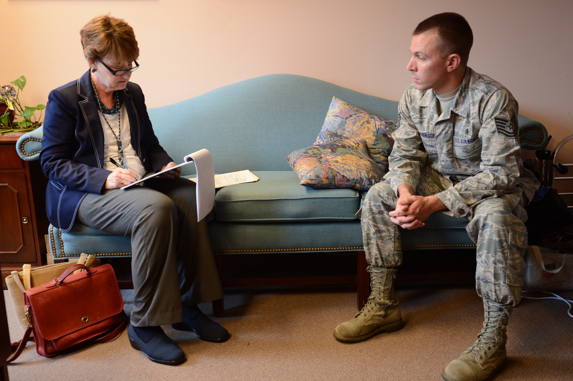 Susanne Shafer, a reporter with The Associated Press, interviews U.S. Air Force Tech. Sgt. Richard Anderson, a 20th Medical Group mental health flight technician, about his recent experience in Dads 101. Anderson is a new father and said that the class was incredibly valuable to him learning how to take care of a baby. (U.S. Air Force photo by Airman 1st Class Jonathan Bass/Released)