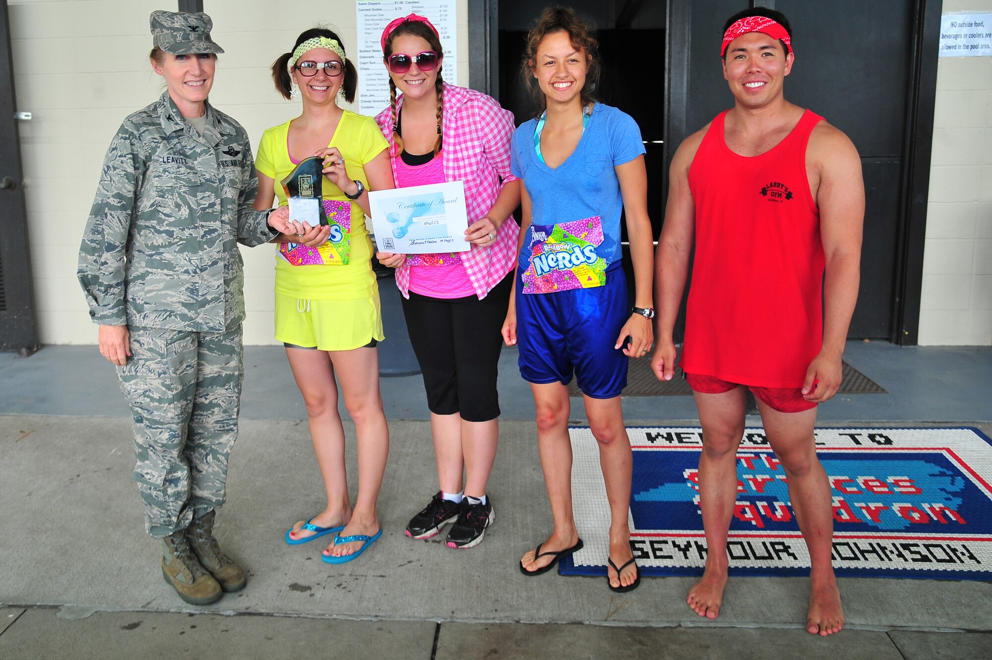 U.S. Air Force Col. Jeannie Leavitt, 4th Fighter Wing commander, presents the 4th Communications Squadron team with an award for the fastest race time during the Build-a-Boat competition at Seymour Johnson Air Force Base, N.C., Aug. 14, 2013. The “Nerds” won the competition with a race-time of 47 seconds. (U.S. Air Force photo by Senior Airman Aubrey White/Released)