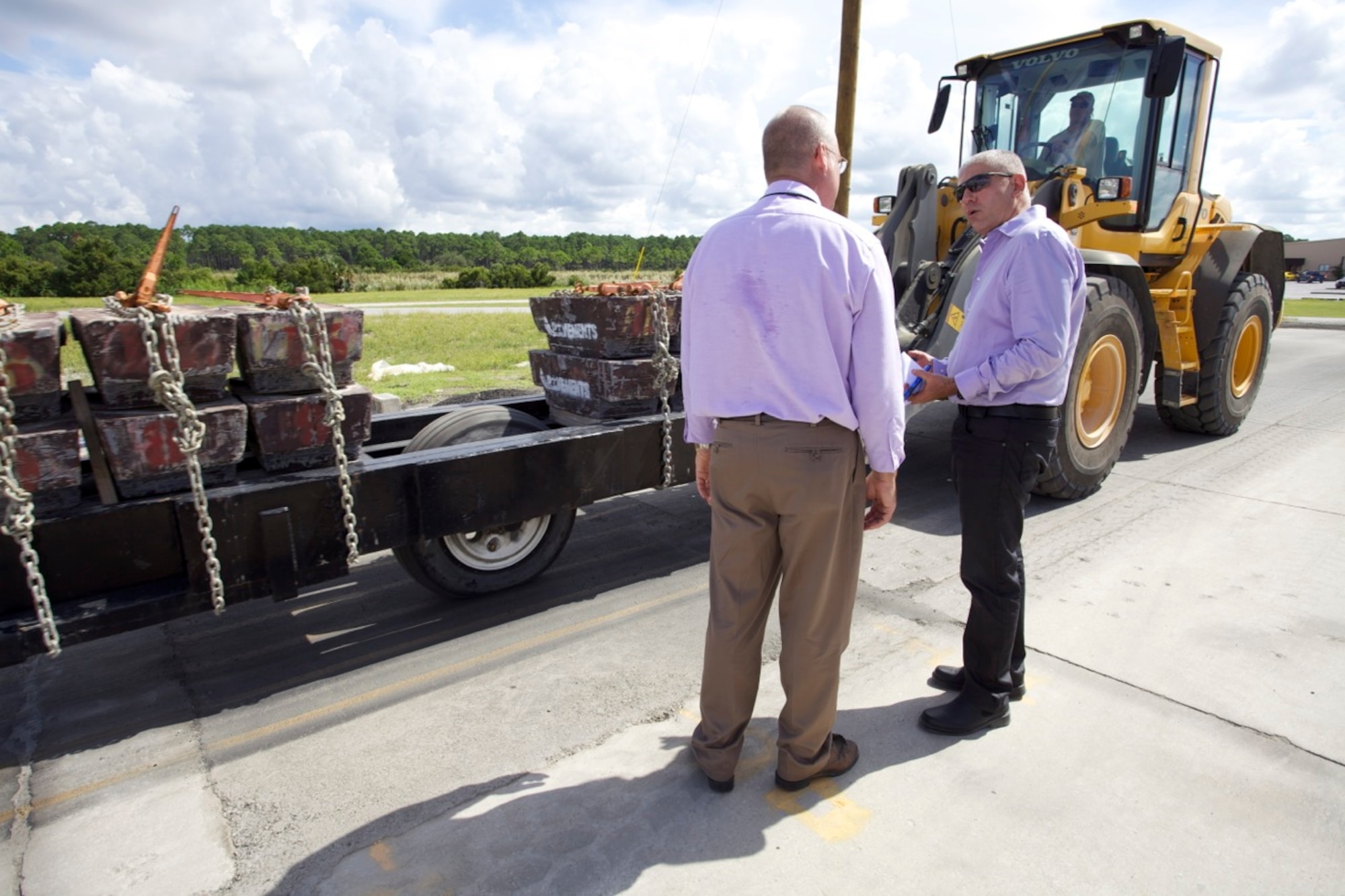 TYNDALL AIR FORCE BASE, Fla. – From left, Lance Filler, airfield damage repair modernization analyst at Det. 1, Air Force Civil Engineer Center, here, shows Lt. Col. Ron Ben Sahal, head of the Israeli air force’s civil engineer branch, a simulated F-15 traffic test over a repaired section of pavement during his visit Aug. 15. ADR experts at AFCEC perform tests like this to evaluate the strength and durability of an asphalt repair. (U.S. Air Force photo/Eddie Green)