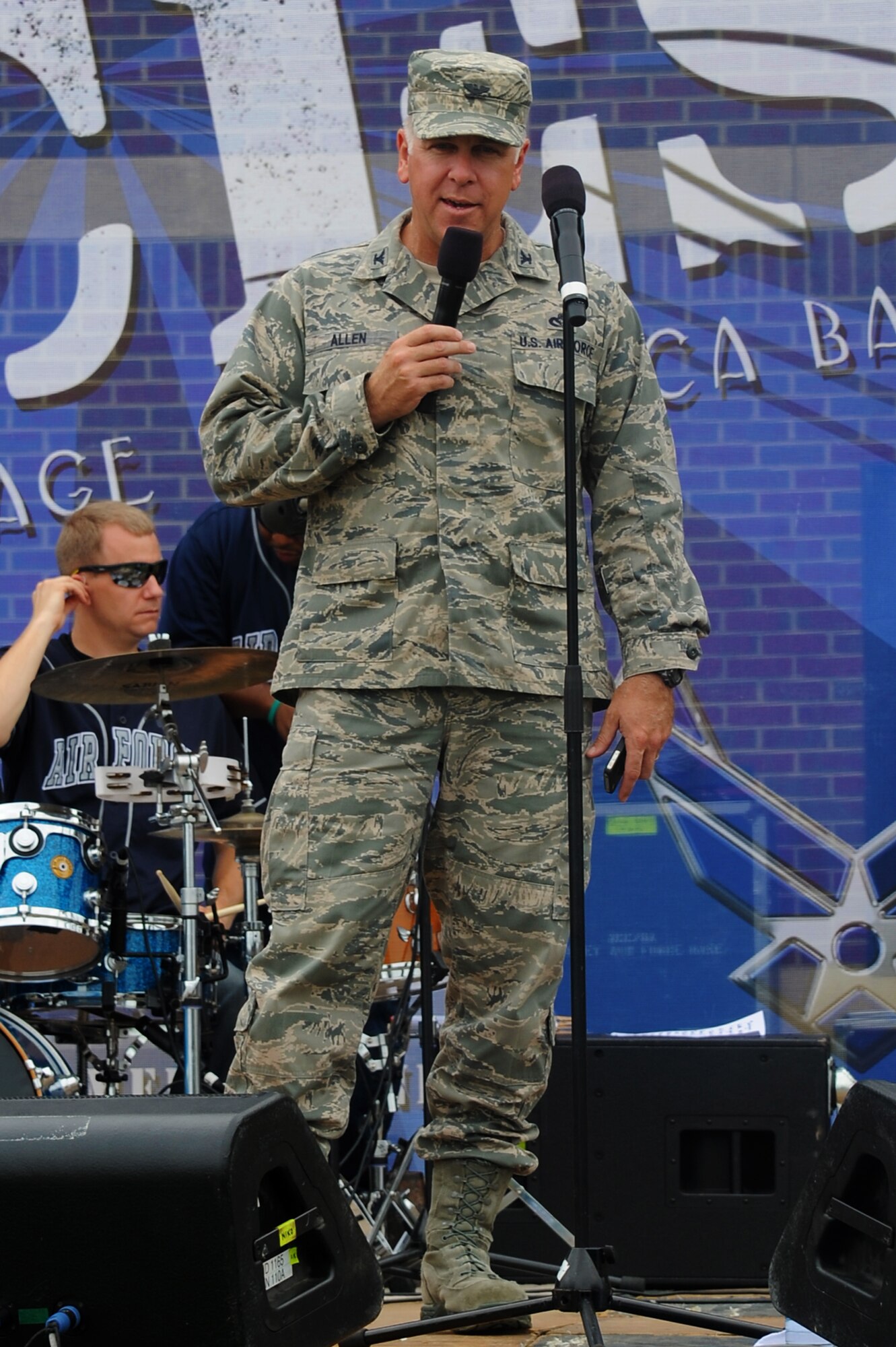 U.S. Air Force Col. John J. Allen Jr., 633rd Air Base Wing commander, speaks to Service members during the “We Are Family” campaign reunion at Langley Air Force Base, Va., Aug. 16, 2013. The 60-day campaign finished with the reunion and block party, which brought together Airmen to focus on revitalizing the wingman culture at Langley AFB. (U.S. Air Force photo by Airman 1st Class Victoria H.Taylor/Released)