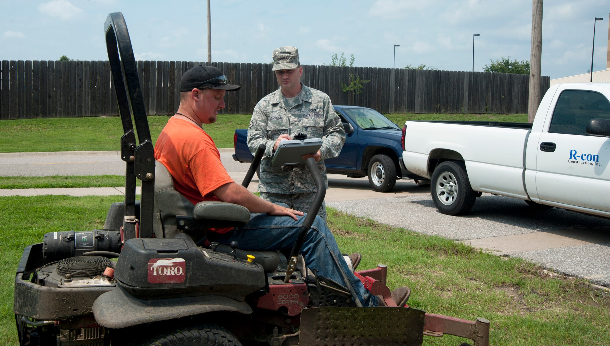 Staff Sgt. David VanHorn, 22nd Civil Engineer contracting officer, performs a monthly inspection with a grounds contractor Aug. 15, 2013, at McConnell Air Force Base, Kan. These inspections ensure that the work performed by the contractors is up to Air Force Standards. (U.S. Air Force photo/Airman 1st Class Colby L. Hardin)