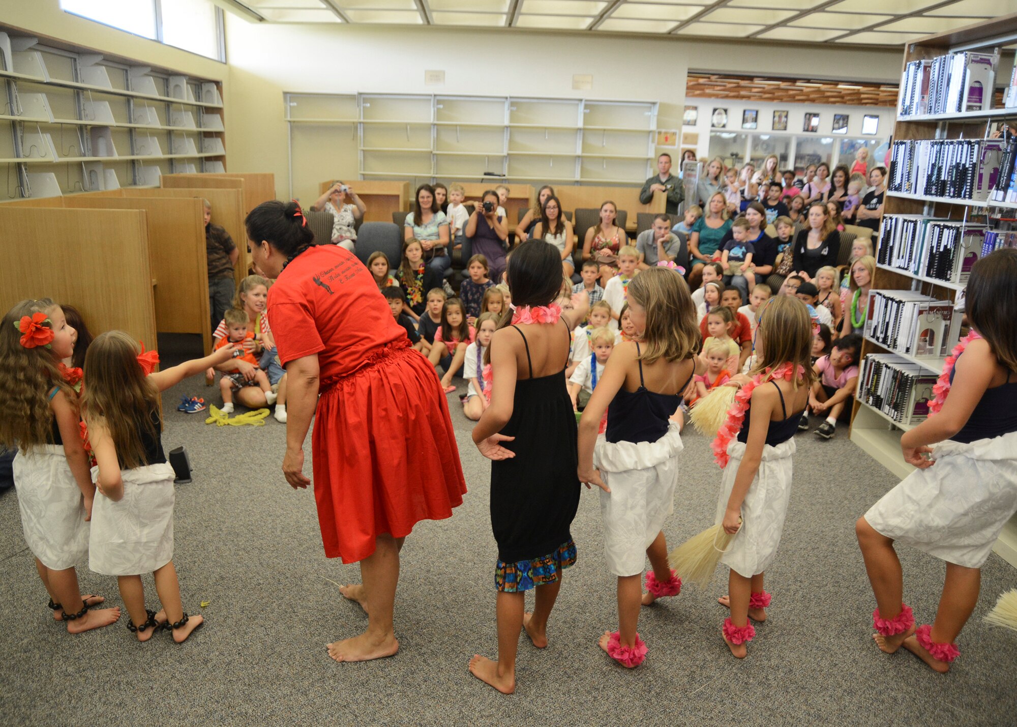 The Ka Ohana O Keolanani Halau expresses their gratitude to the audience for allowing them to perform. (U.S. Air Force photo by Rebecca Amber) 