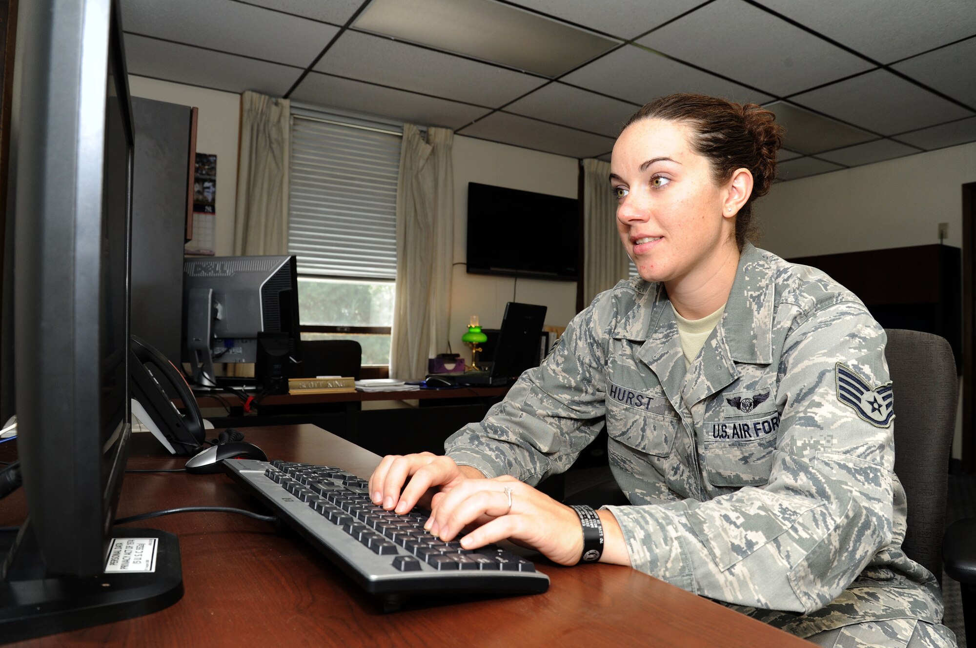 Staff Sgt. Ashley Hurst, Personnel Recovery Academy survival, evasion, resistance and escape/personnel recovery analyst, generates products to support the war-fighter at Fairchild Air Force Base, Wash., Aug. 13, 2013. Hurst was selected as Fairchild's Finest. (U.S. Air Force photo by Airman 1st Class Janelle Patiño/Released)
