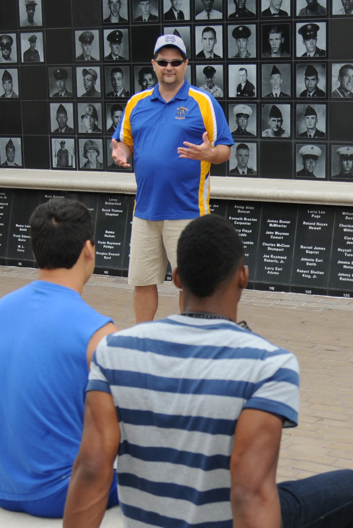 Retired  Master Sgt. Rick Crawford, 338th Training Squadron instructor, reinforces the importance of a positive attitude in all situations to St. Martin High School senior football players during a leadership seminar Aug. 17, 2013, at the Mississippi Vietnam Veterans Memorial in Ocean Springs, Miss. The seminar was a collaboration of the St. Martin Gridiron Club and Keesler personnel, who also briefed the seniors on good attitudes, values, beliefs and teamwork.  (Courtesy photo by Kemberly Groue)
