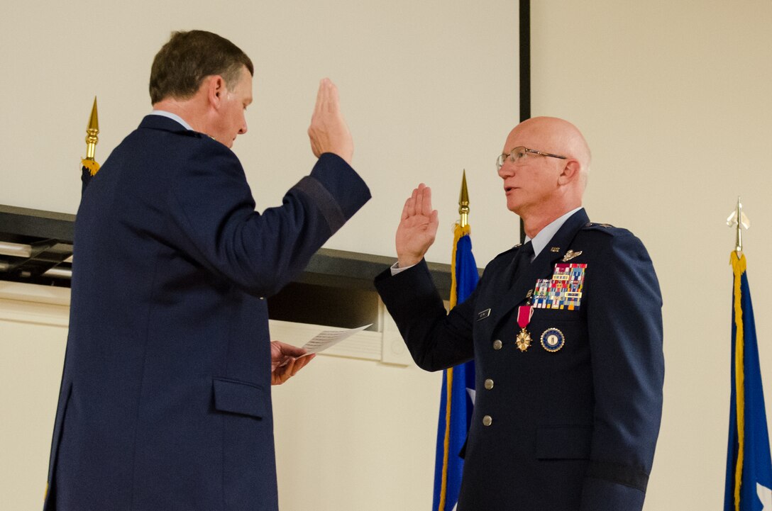 Kentucky’s adjutant general, Maj. Gen. Edward Tonini (left), administers the oath of office to Brig. Gen. Mark Kraus, a Kentucky Air National Guardsman who serves as Air National Guard assistant to the commander of U.S. Air Forces Central, during a ceremony promoting Kraus to the rank of major general at the Kentucky Air National Guard Base in Louisville, Ky., on Aug. 18, 2013. Kraus, a former commander of the Kentucky Air Guard’s 123rd Airlift Wing, served as the Commonwealth’s assistant adjutant general for Air from October 2008 to May 2013. (U.S. Air National Guard photo by Airman Joshua Horton)