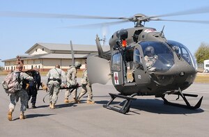 Simulated victims are medically evacuated from Yano Hall by flatiron personnel, after a shooting scenario during the Fort Rucker, Ala. all-hazards exercise March 13, 2013. (Courtesy photo/Released)