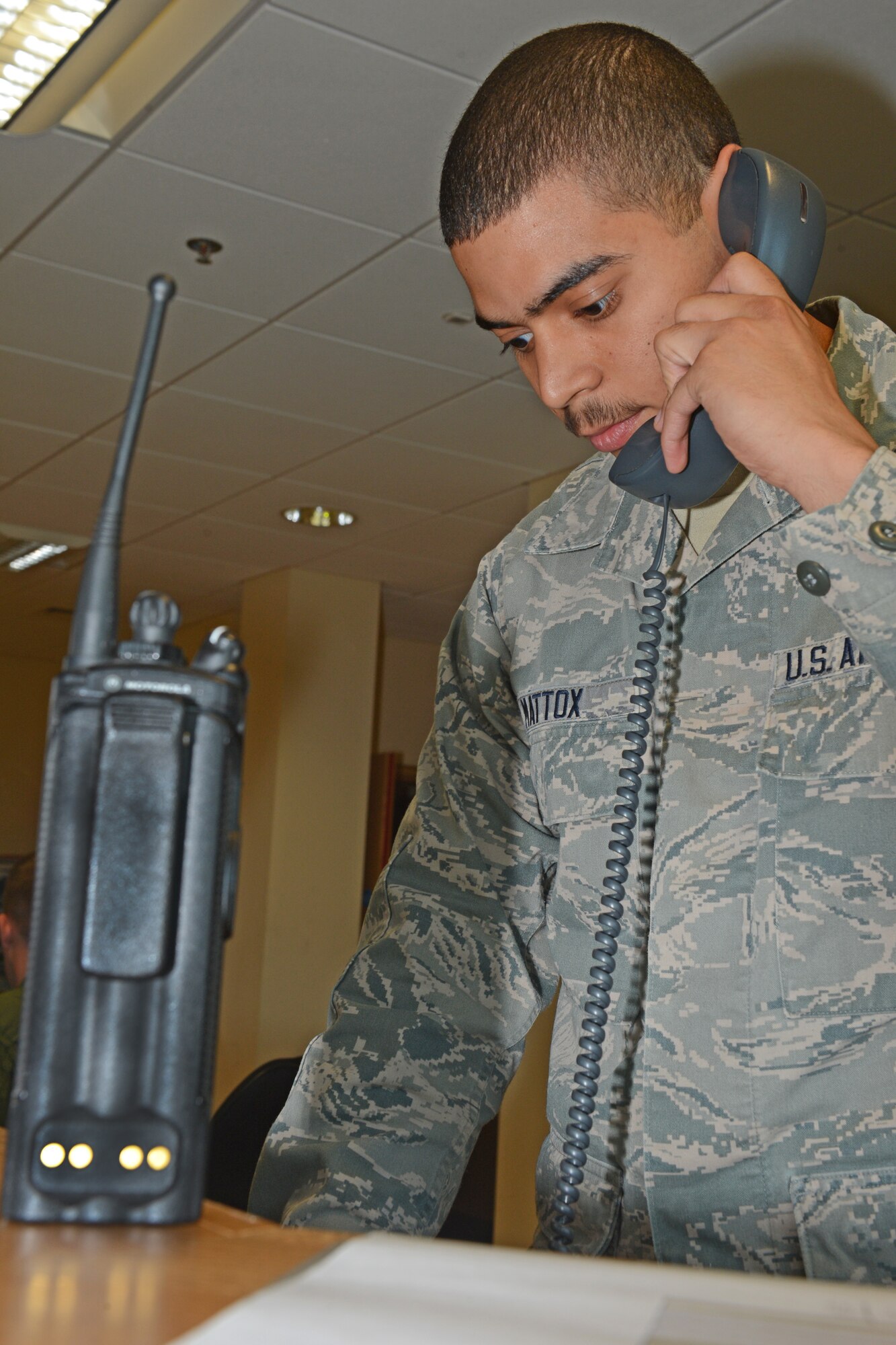 Airman 1st Class Ryan Mattox, 493rd Fighter Squadron aviation resource management apprentice, performs duty desk operations at Royal Air Force Lakenheath, England, Aug. 20, 2013. Mattox was nominated for a Liberty Spotlight because he displays the core value of “Service Before Self.” (U.S. Air Force photo by Airman 1st Class Trevor T. McBride/Released) 