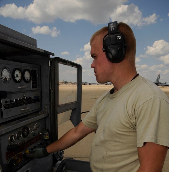 Senior Airman Nicholas Kupferle, 96th Aircraft Maintenance Unit crew chief, tests an A/M32 diesel generator on Barksdale Air Force Base, La., Aug. 19, 2013. Kupferle tested the generator in order to make sure it functioned properly to provide power to aircraft. (U.S. Air Force photo/Airman 1st Class Andrew Moua)