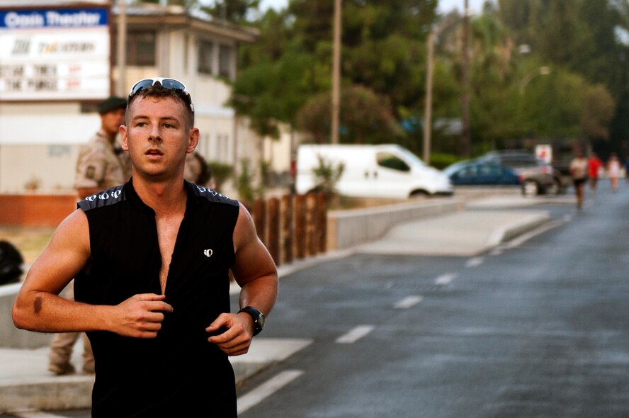Robert Wilson completes the 5K run portion of a sprint triathlon Aug. 17, 2013, at Incirlik Air Base, Turkey. A total of 65 athletes competed in the Incirlik sprint triathlon. (U.S. Air Force photo by Senior Airman Daniel Phelps/Released)