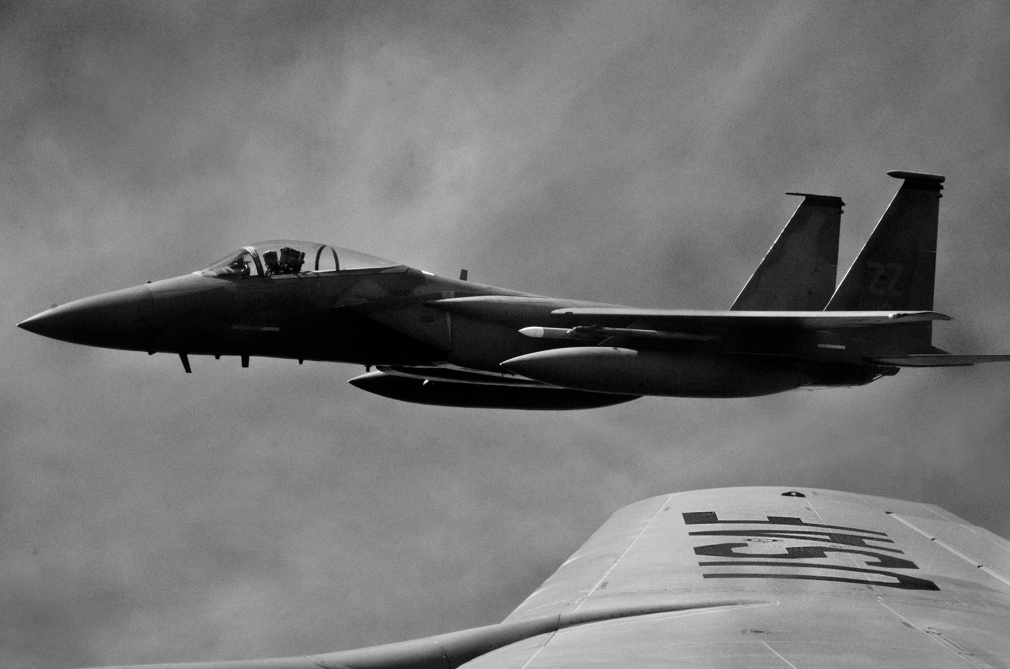 A 67th Fighter Squadron F-15 Eagle from Kadena Air Base, Japan, flies over the western Pacific Ocean near Andersen Air Force Base, Guam, as part of the 67th FS Aviation Training Relocation Aug. 14, 2013. The ATR increases the operational readiness of 48 pilots assigned to the 67th Fighter Squadron, as well as reduces the impact of training in the local communities near Okinawa, Japan. (U.S. Air Force photo illustration by Airman 1st Class Emily A. Bradley/Released)