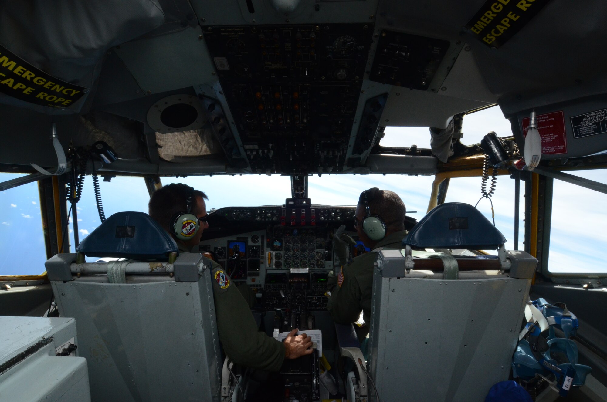 (Left) Lt. Col. Todd Bergeson and (right) Capt. Brandon Hardin, 151st Air Refueling Squadron pilots, operate a KC-135 Stratotanker in support of the 67th Fighter Squadron’sAviation Training Relocation near Andersen Air Force Base, Guam, Aug. 14, 2013. The ATR increases the operational readiness of 48 pilots assigned to the 67th Fighter Squadron, as well as reduces the impact of training in the local communities near Okinawa, Japan. (U.S. Air Force photo by Airman 1st Class Emily A. Bradley/Released)