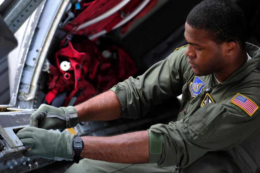Airman 1st Class Wynthom Thomas conducts pre-flight checks on a C-130 Hercules Aug. 17, 2013, at Yokota Air Base, Japan. Thomas, as a 36th Airlift Squadron loadmaster, worked hand-in-hand with maintainers to ensure the aircraft was ready for flight. (U.S. Air Force photo by Senior Airman Cody H. Ramirez)