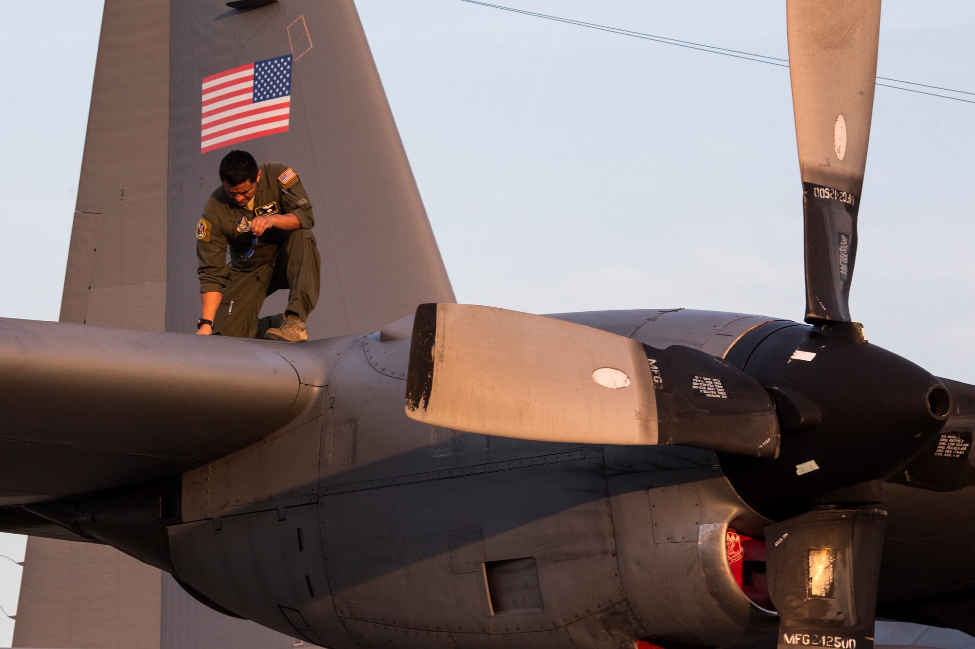 YOKOTA AIR BASE, Japan -- Tech. Sgt. Robert Dela Caza, 36th Airlift Squadron flight engineer, inspects a C-130 Hercules fuel tank at Yokota Air Base, Japan, Aug. 17, 2013. Airmen from the 374th Maintenance Group and 374th Operations Group prepared for the C-130's participation in a large formation surge flight. (U.S. Air Force photo by Osakabe Yasuo)