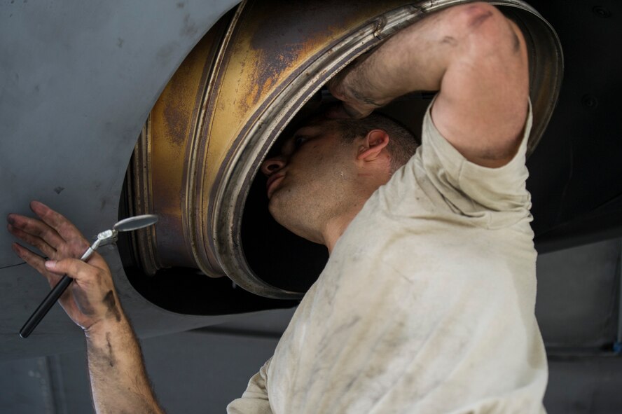 Staff Sgt. Joseph Muscarella performs intake and exhaust inspections on a C-130 Hercules Aug. 17, 2013 at Yokota Air Base, Japan. Muscarella was part of eight teams that worked all day to prepare aircraft for a large formation flight. (U.S. Air Force photo by Senior Airman Cody H. Ramirez)