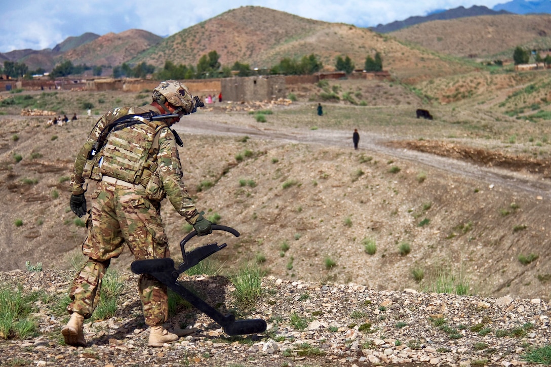 U.S. Army Sgt. Kenton D. Smith uses a “Goldie” wire to detect roadside bombs while patrolling to clear routes in Khowst province, Afghanistan, Aug. 14, 2013. Smith, a combat engineer, is assigned to the 101st Airborne Division's Company A, 4th Brigade Special Troops Battalion, 4th Brigade Combat Team.