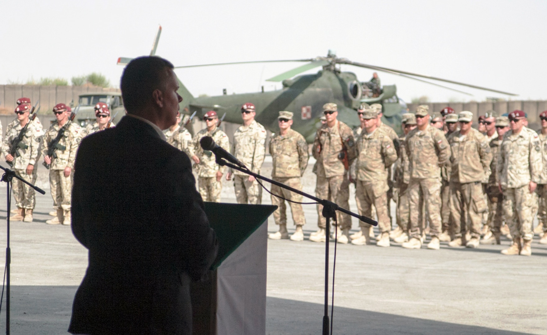 Illinois National Guard Soldiers stand in formation with their Polish brothers in arms as Tomasz Siemoniak, Poland's minister of national defense, addresses Soldiers of Task Force White Eagle.