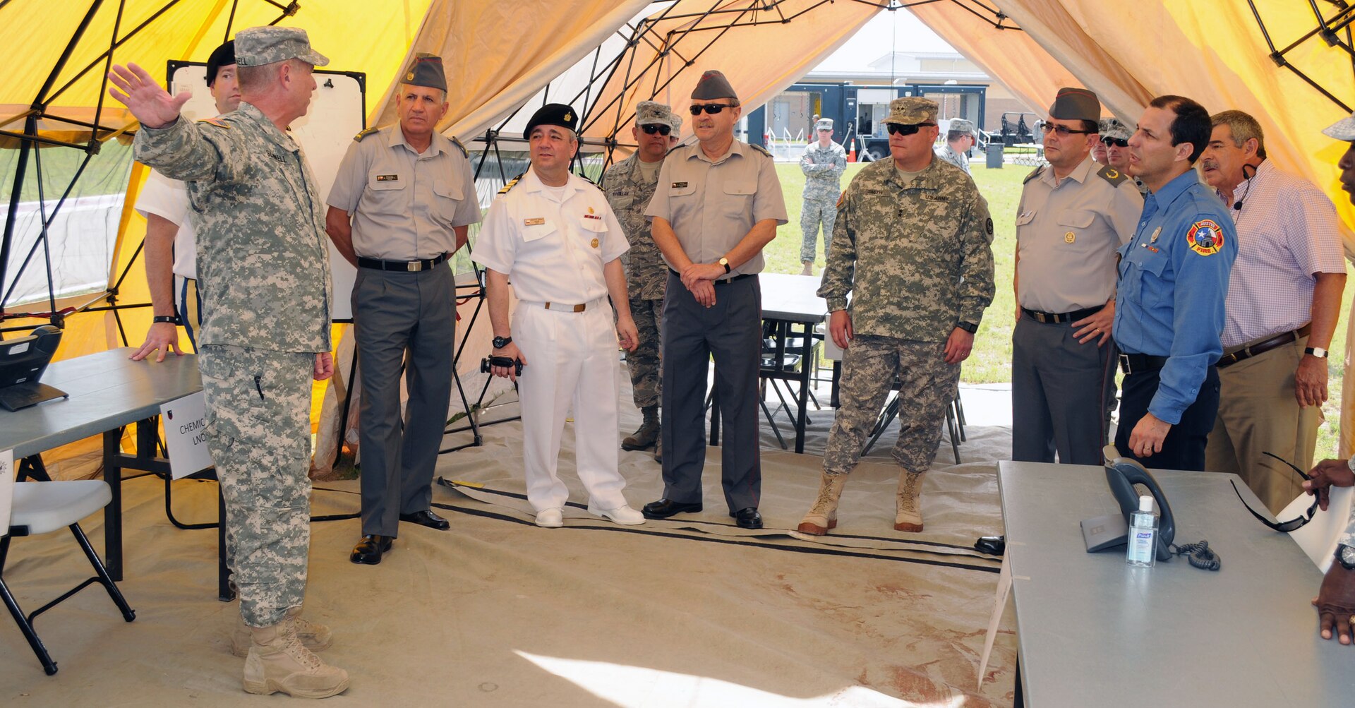 Members of the Chilean armed forces visit Joint Task Force 71 (Maneuver Enhancement Brigade) July 24 at the Round Rock Armed Forces Reserve Center. Emergency response was the theme for the visit, as the Minuteman Brigade offered a tour to demonstrate the capabilities and interagency relationships inherent to the Homeland Response Force mission.