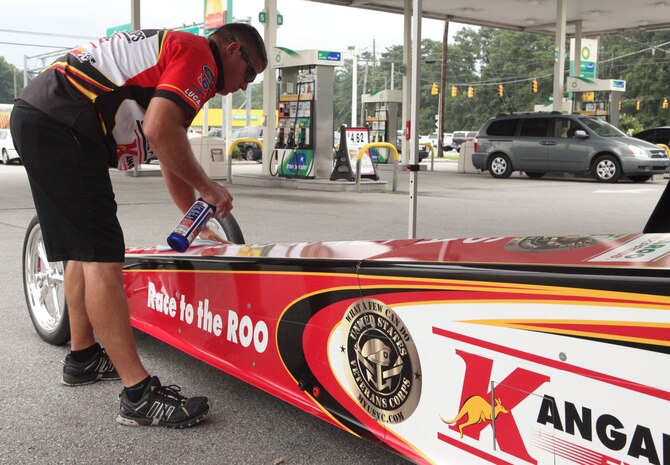 Don O’Neal, retired Army soldier and drag racer, cleans his dragster during the third annual Salute Our Troops tour in Jacksonville, N.C., Aug. 14. The tour entails Salute Our Troops volunteers traveling across the United States looking to collect donations from local communities for the Fisher House Foundation by selling merchandise and interacting with the local community. Since 1990, the Fisher House Foundation has provided over 5 million nights of lodging to service members, veterans and their families. With every dollar earned during the tour, 96 cents goes directly to the foundation.