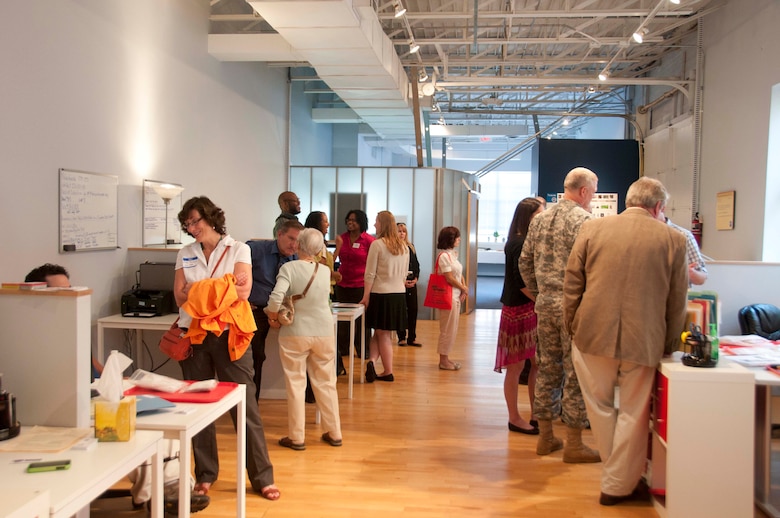 Visitors mingle with lab technicians at the Alexandria Laboratory open house on Aug. 20, 2013. 