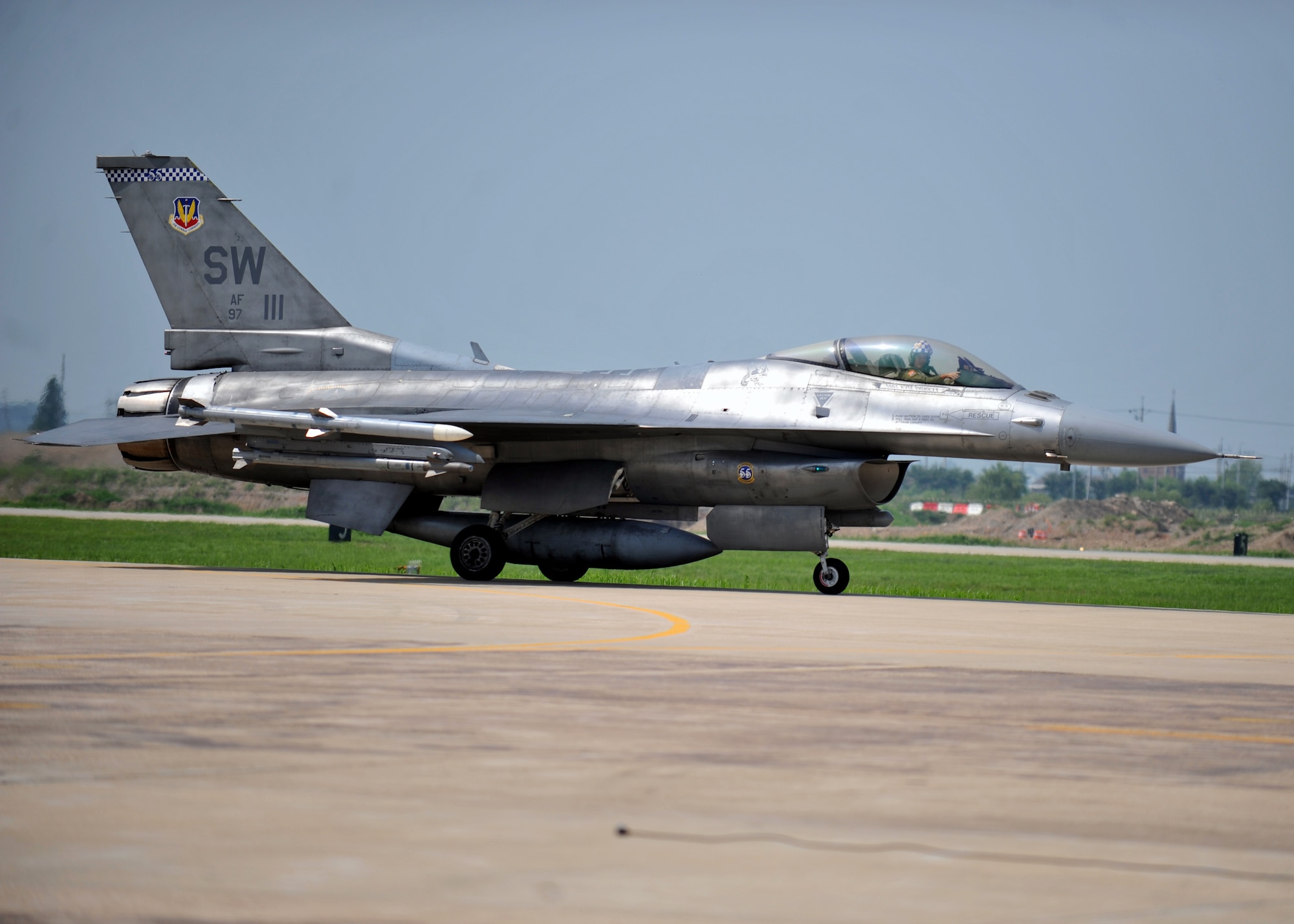 Lt. Col. Douglas Schaare, a Reservist in the 55th Expeditionary Fighter Squadron, taxis in an F-16 Fighting Falcon after flying his final sortie in the Air Force at Osan Air Base, Republic of Korea, July 26, 2013. Schaare, who began his career flying the F-4 Phantom, has flown the F-16 for the past 20 years. (U.S. Air Force photo/Senior Airman Siuta B. Ika)